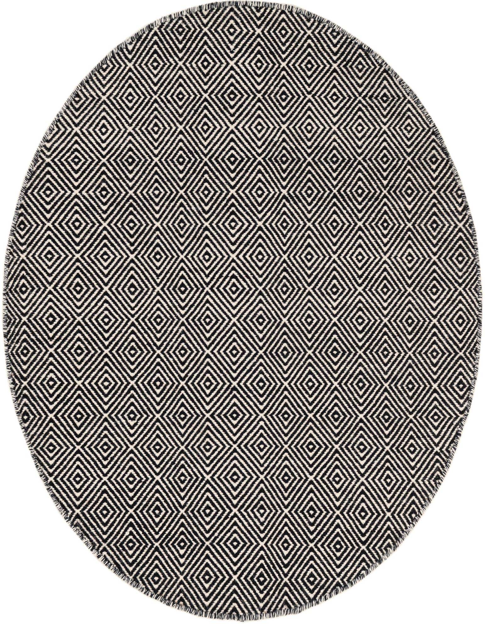 A round 4'1" black and white flatweave rug with a repeating diamond trellis pattern and fringed edges.