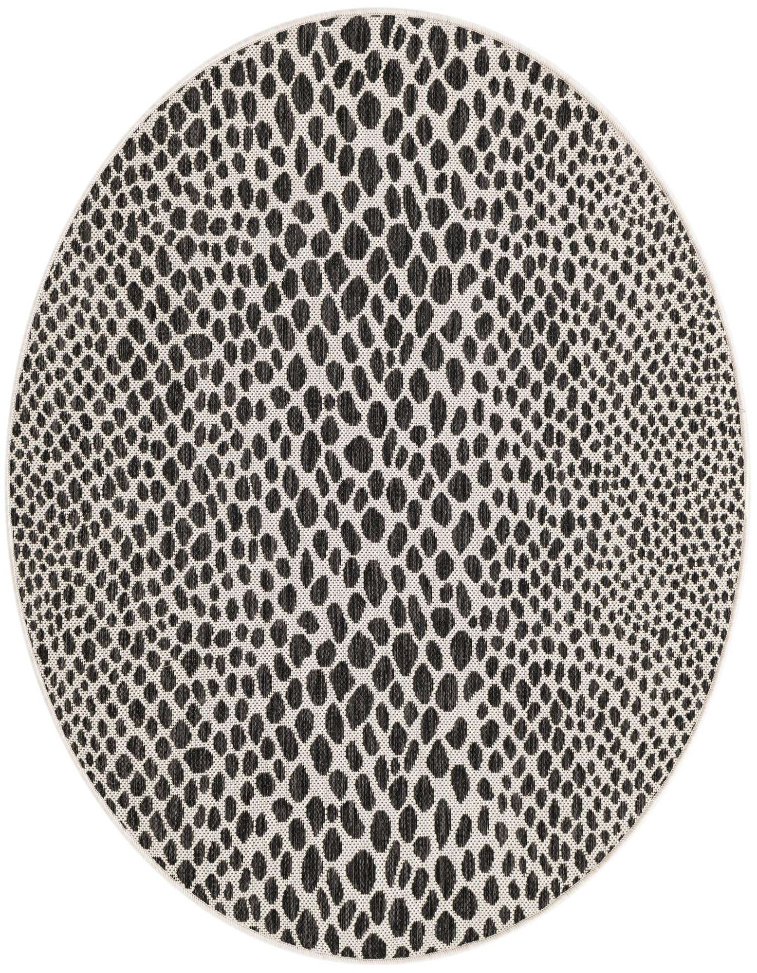 A 4' round black and white modern zebra print rug with a textured flatweave, suitable for indoor or outdoor use.