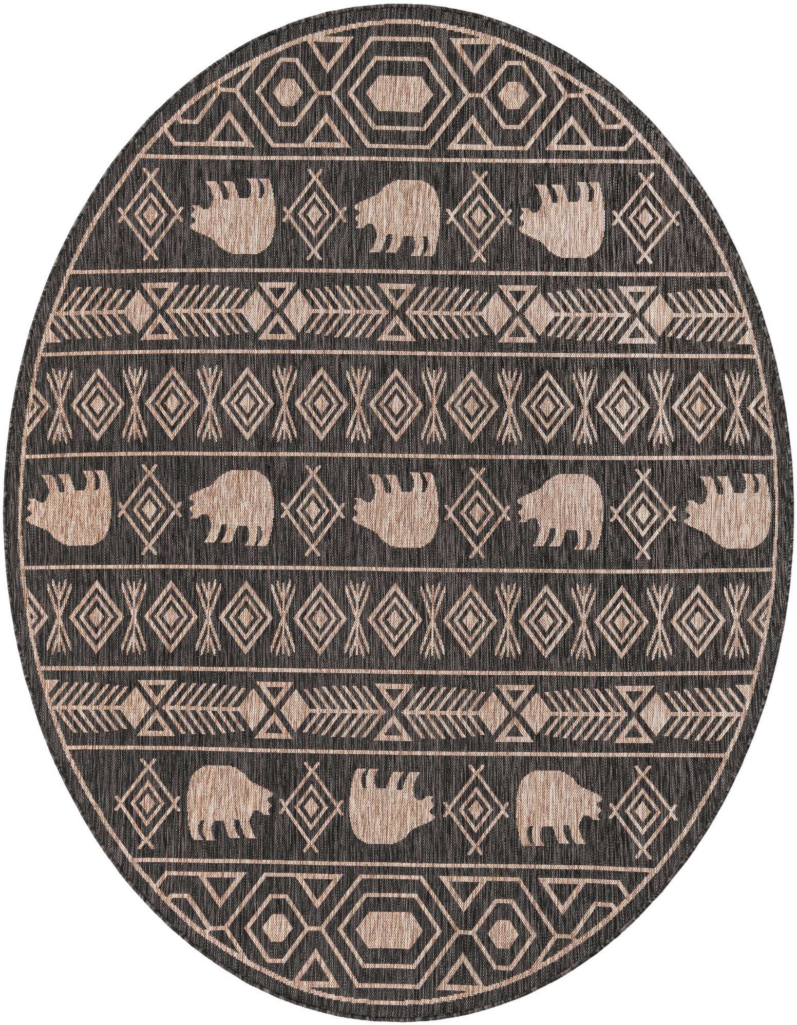 A round 7'10" black and beige tribal rug with bear silhouettes and geometric patterns, suitable for a patio.