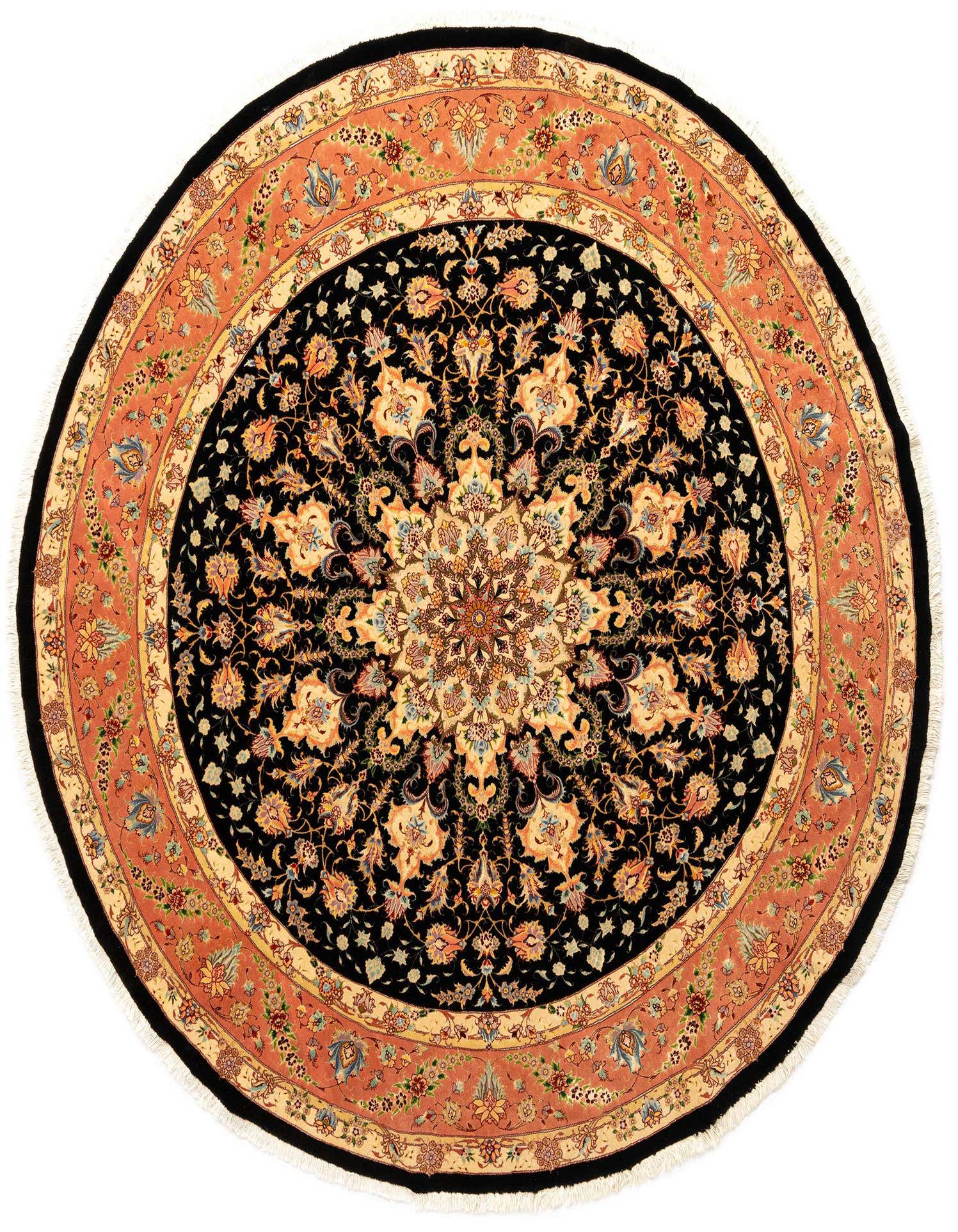 A round 8'2" black Persian Tabriz rug with a detailed floral medallion and an ornate coral border.