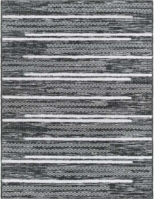 A 10 ft runner rug featuring a modern black and white striped pattern with varied textures, ideal for a hallway.