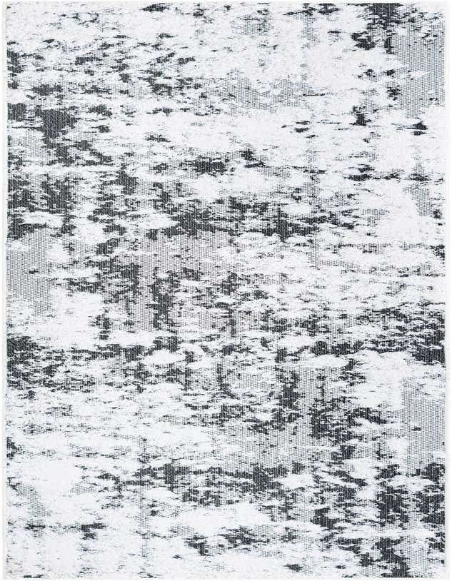 A close-up of an 8 ft runner rug with an abstract pattern in black and white, featuring a textured, high-pile design.