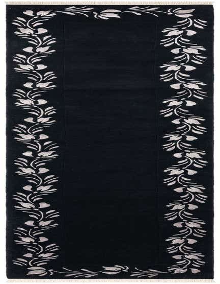 A 13 ft black runner rug with a modern Persian floral border in light grey, suitable for a hallway.