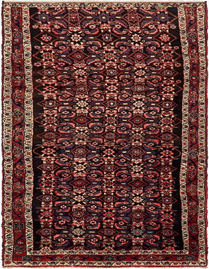 A 10 Ft Hossainabad runner rug with a black background and intricate tribal Persian patterns in red, blue, and cream.