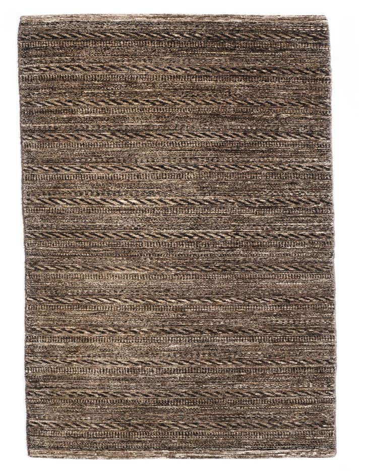 A handmade 8 ft runner rug from the Juma collection, featuring a textured Persian pattern in varying shades of black and dark brown, ideal for a hallway or kitchen.