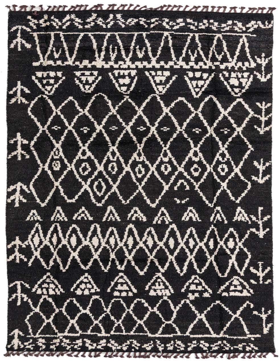 A 12 ft black wool runner rug with a bold white tribal geometric pattern and shag pile.