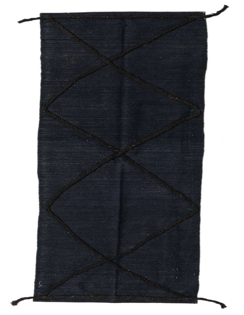 A black 8 ft wool runner rug with a tribal diamond pattern, ideal for a hallway.