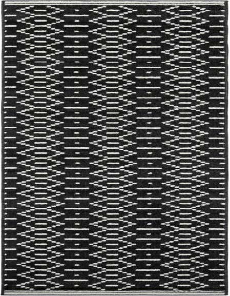 A 12 ft runner rug from the Oslo collection, featuring a modern black and white geometric pattern, ideal for hallways.