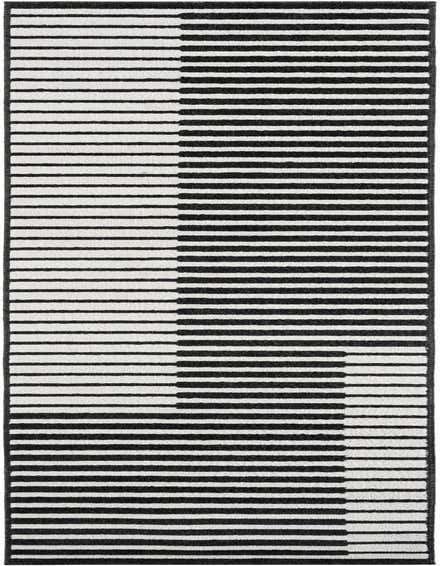 A 12 ft black and white modern striped runner rug with a dynamic, shifting block pattern, ideal for a hallway.