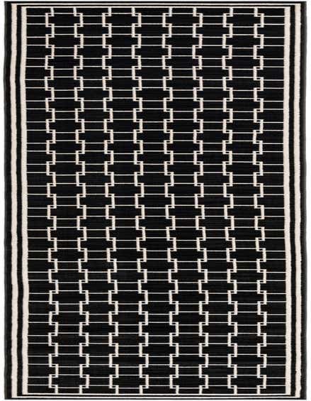 A 12 ft black runner rug with a modern geometric interlocking square pattern in white, framed by a double white border.