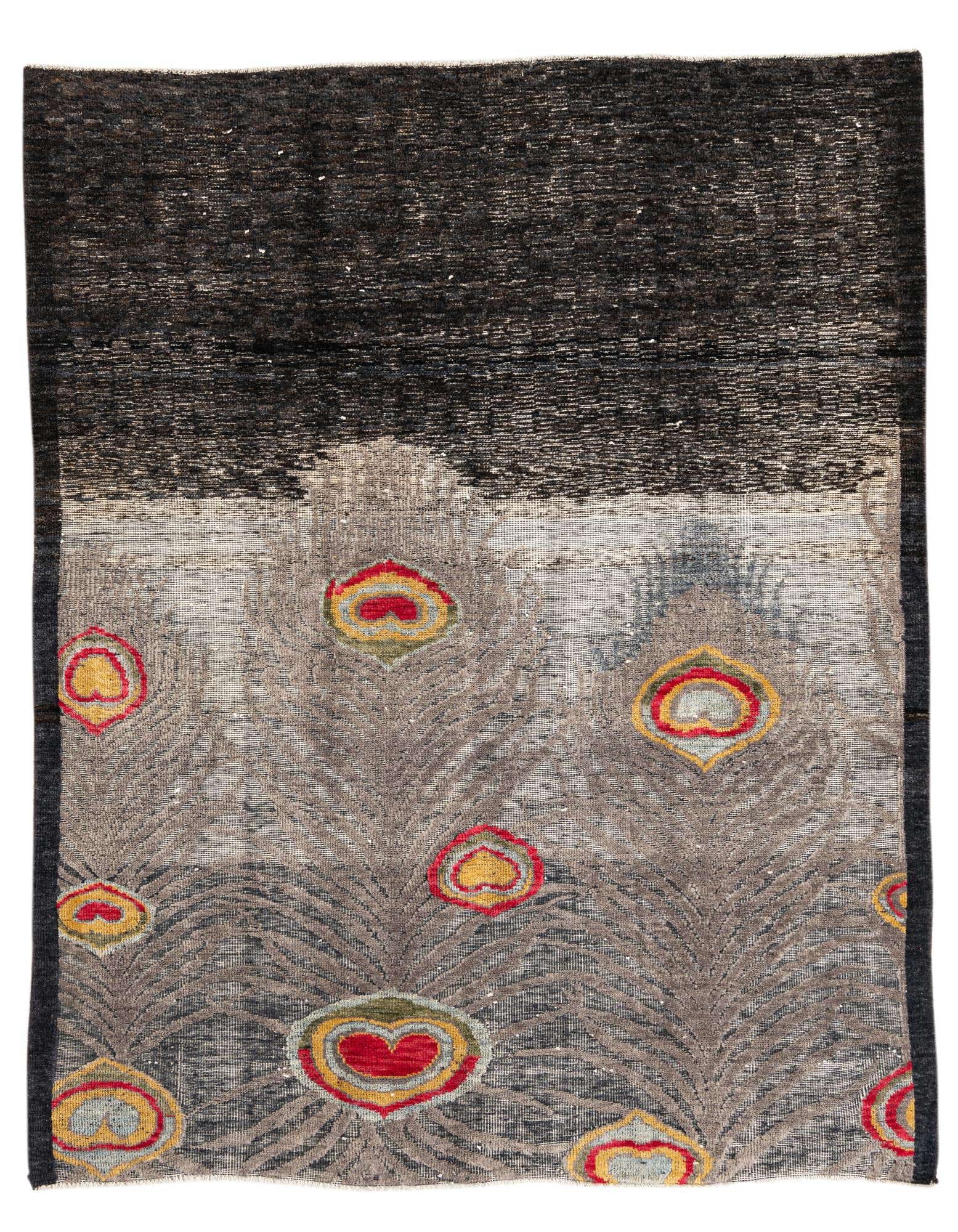 A square black and grey wool rug with a modern abstract design featuring colorful red, yellow, and green accents.