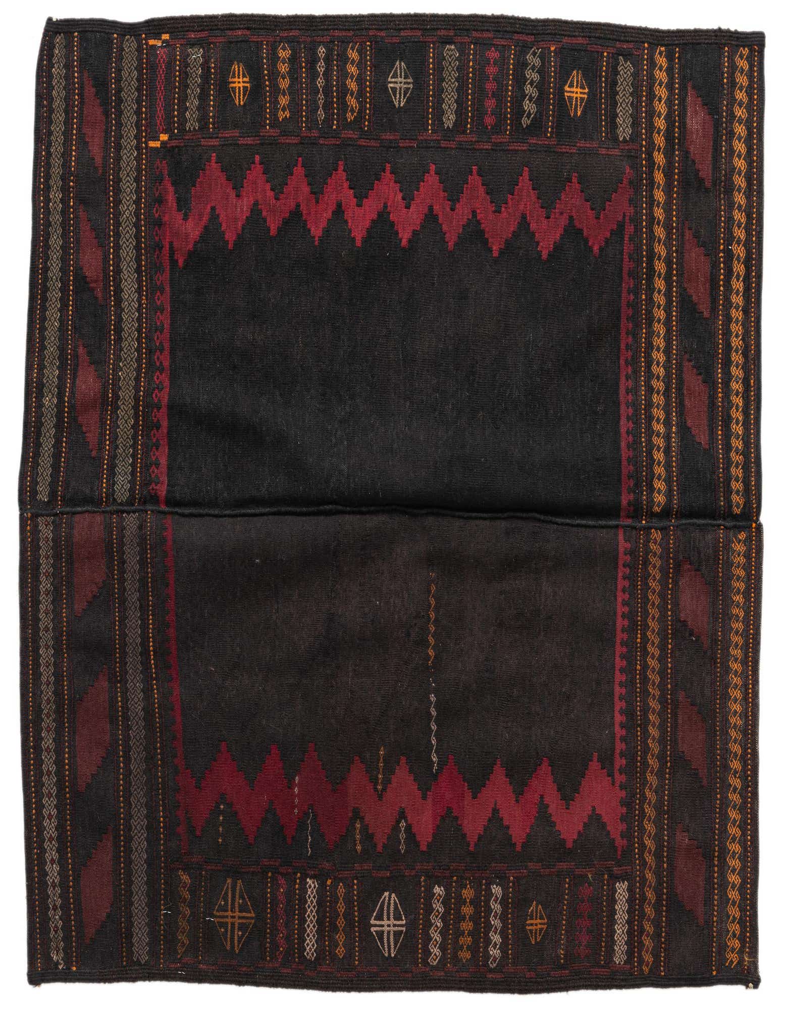 A square black Kilim Modern rug with a bold red zigzag border and tribal patterns in gold, red, and white.