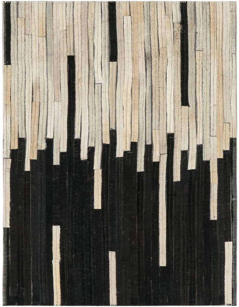 A modern 3 ft runner rug with an abstract pattern of vertical black and ivory cowhide leather strips.
