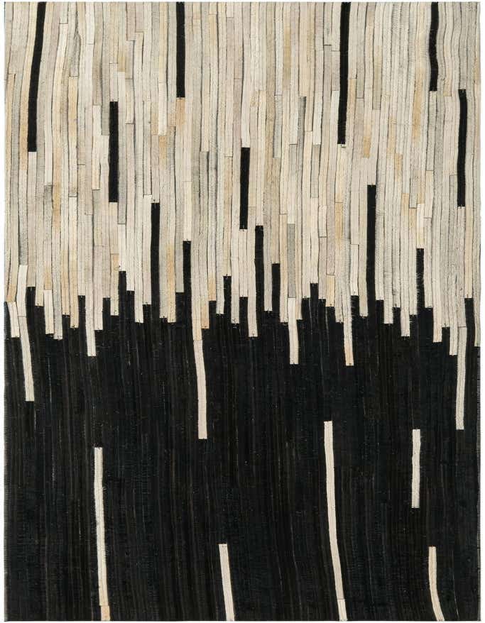 A modern 6 ft runner rug with an abstract design, featuring vertical strips of black and ivory cowhide leather.