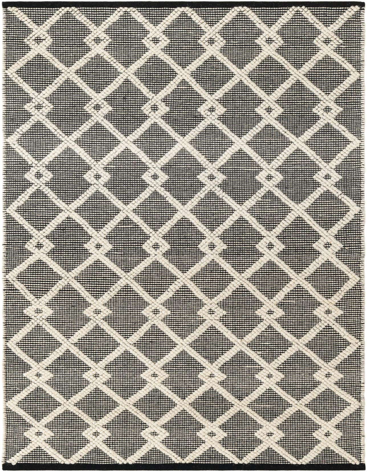 A 4x6 rectangular Jill Zarin Dorset rug featuring a modern black and off-white abstract geometric pattern, ideal for an indoor living room.