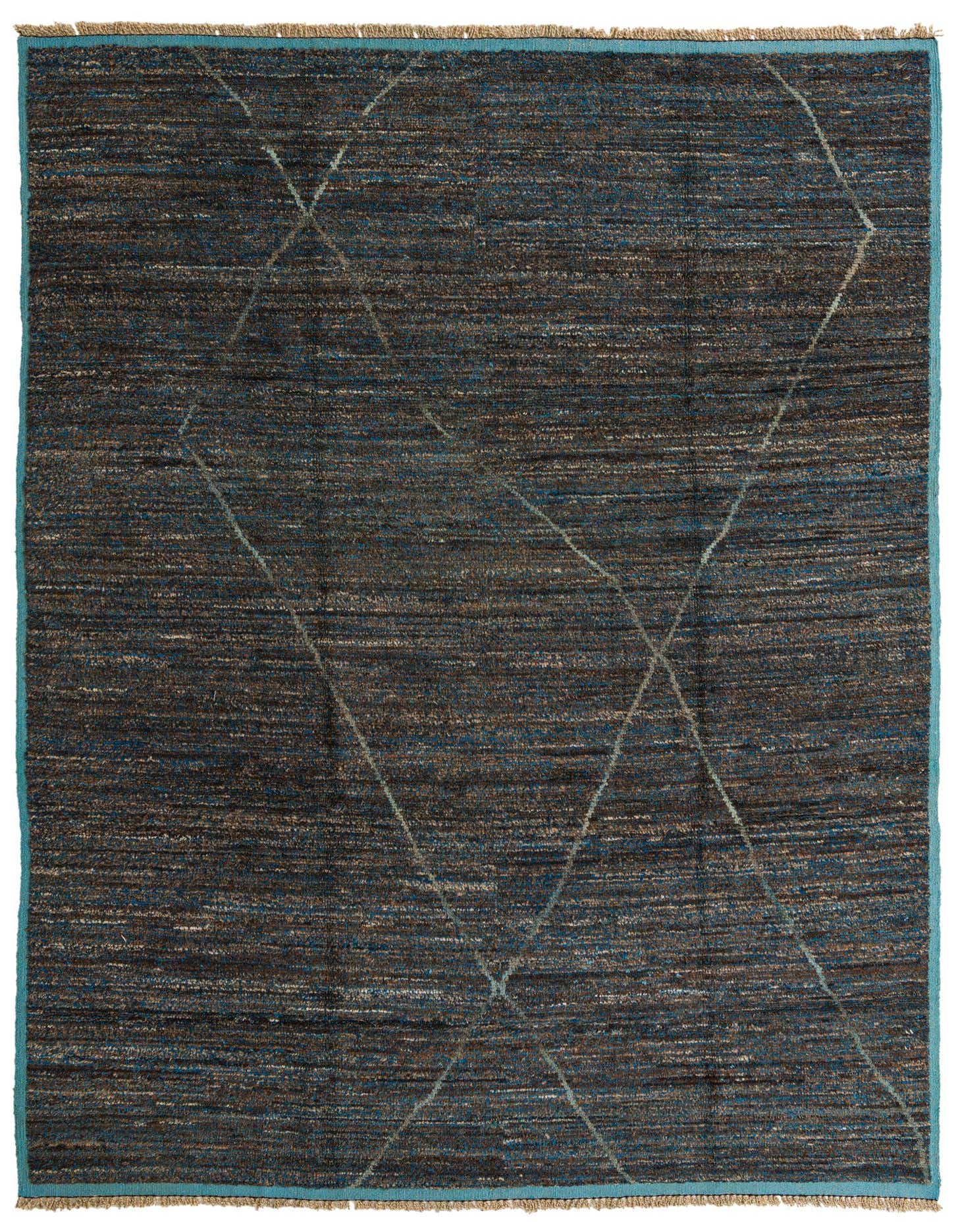 A 9x12 rectangular Moroccan shag rug with a tribal abstract pattern in blues and browns/tans, handmade from wool.