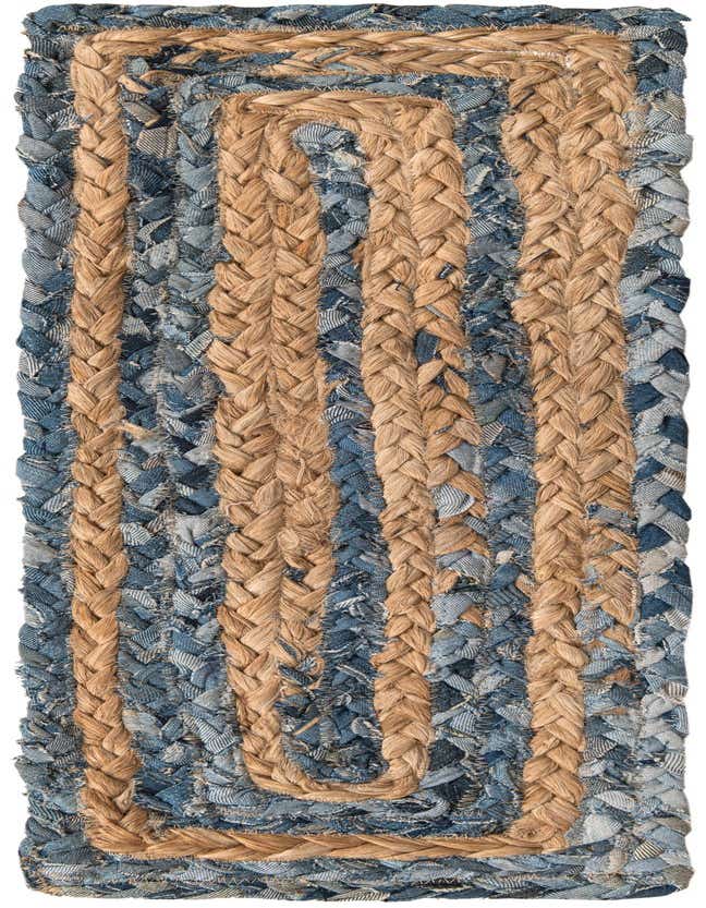A 0' 9 x 2' 6 stair rug featuring a braided pattern of blue denim cotton and natural jute, creating a textured, eco-friendly design.