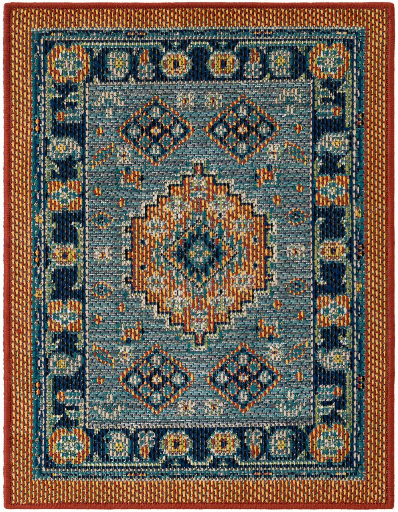 A 2x3 rectangular Baja Outdoor rug featuring a modern geometric pattern in blue, rust red, and hints of orange and yellow.