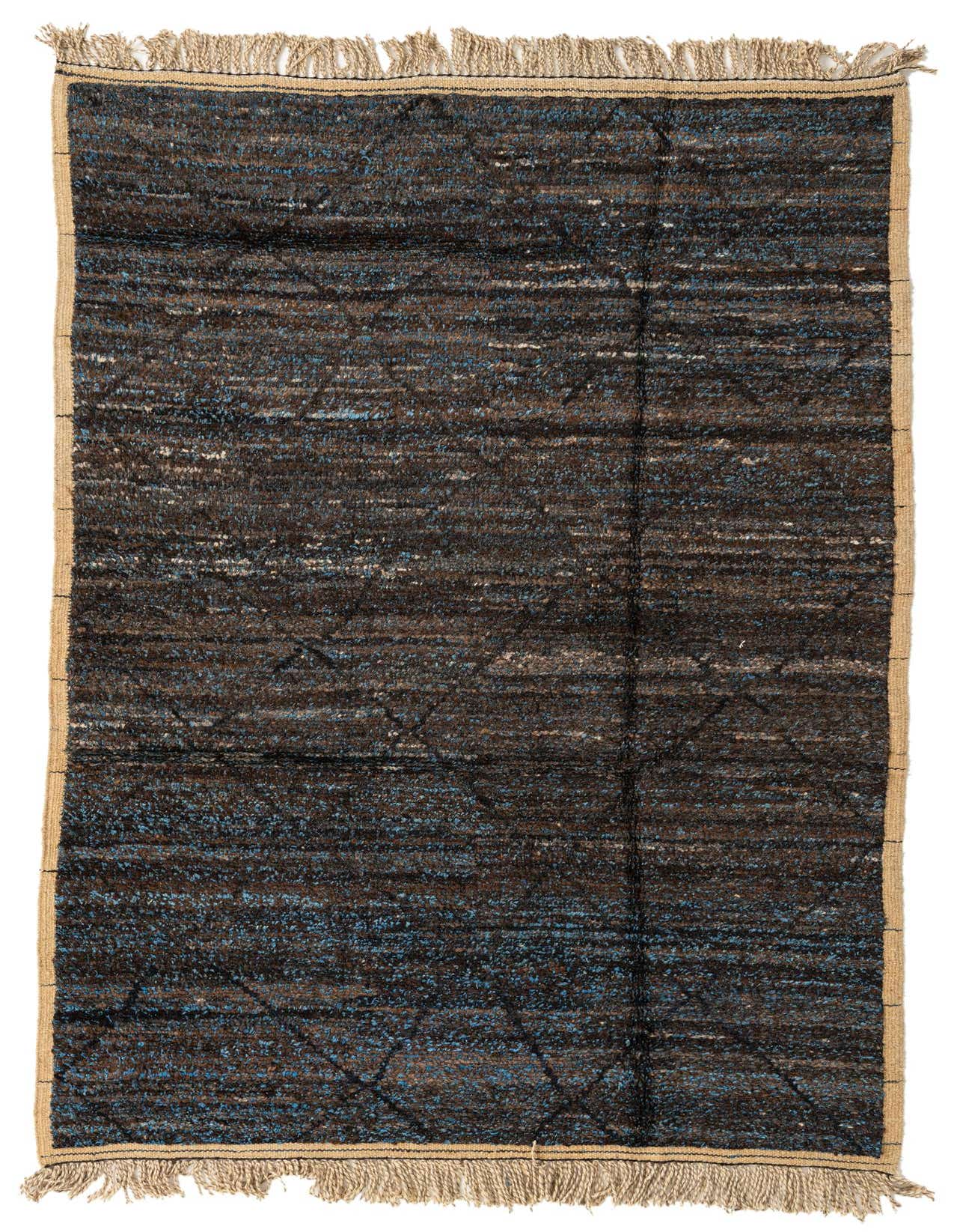 A 5x8 rectangular blue and brown tribal shag rug with abstract patterns and fringed ends, suitable for a living room.
