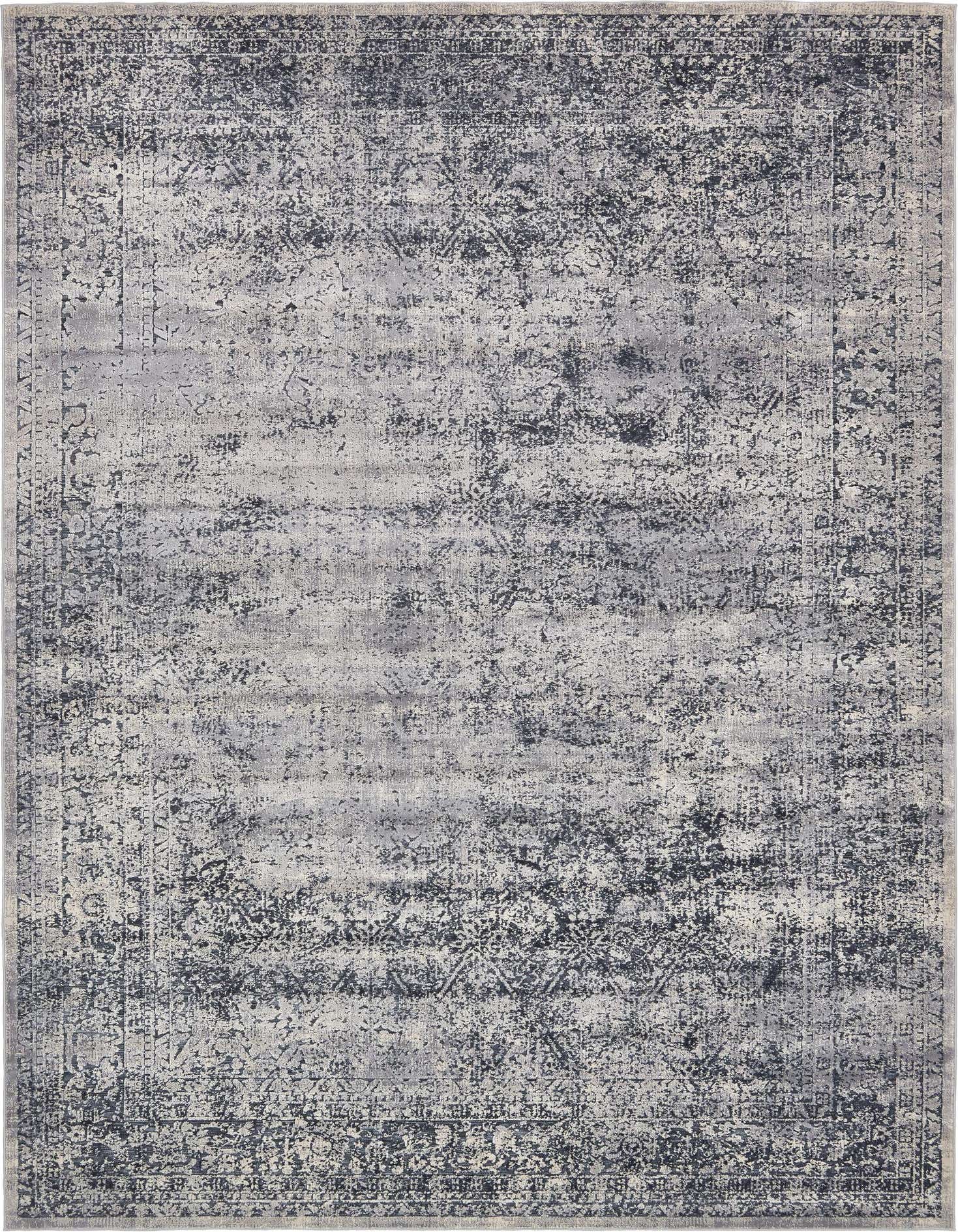 A 9x12 rectangular Eliza collection rug in shades of blue and gray, featuring a distressed traditional pattern with a textured pile.