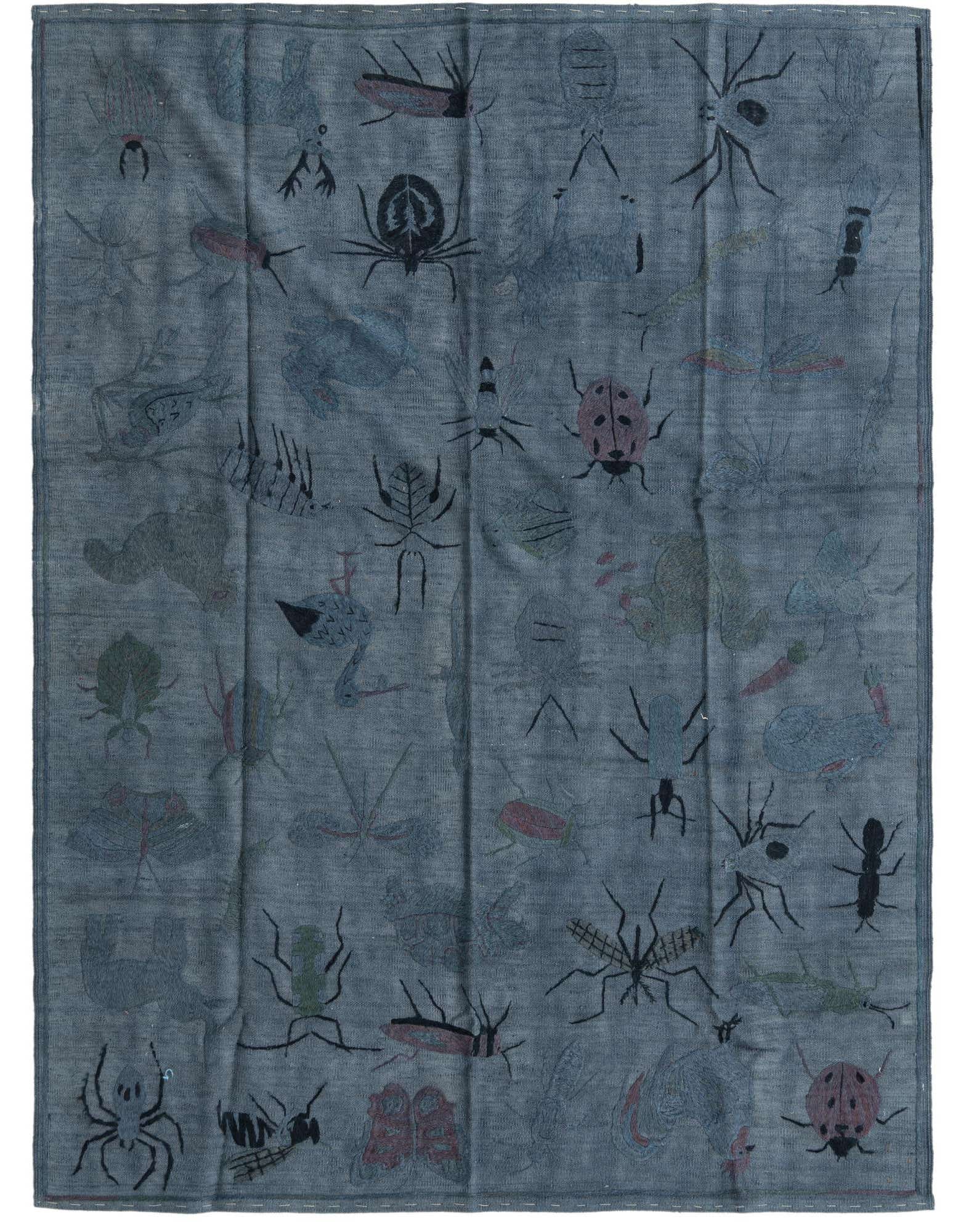 A 5x8 rectangular blue and gray flatweave wool rug with a modern abstract tribal pattern of various insects in different colors.