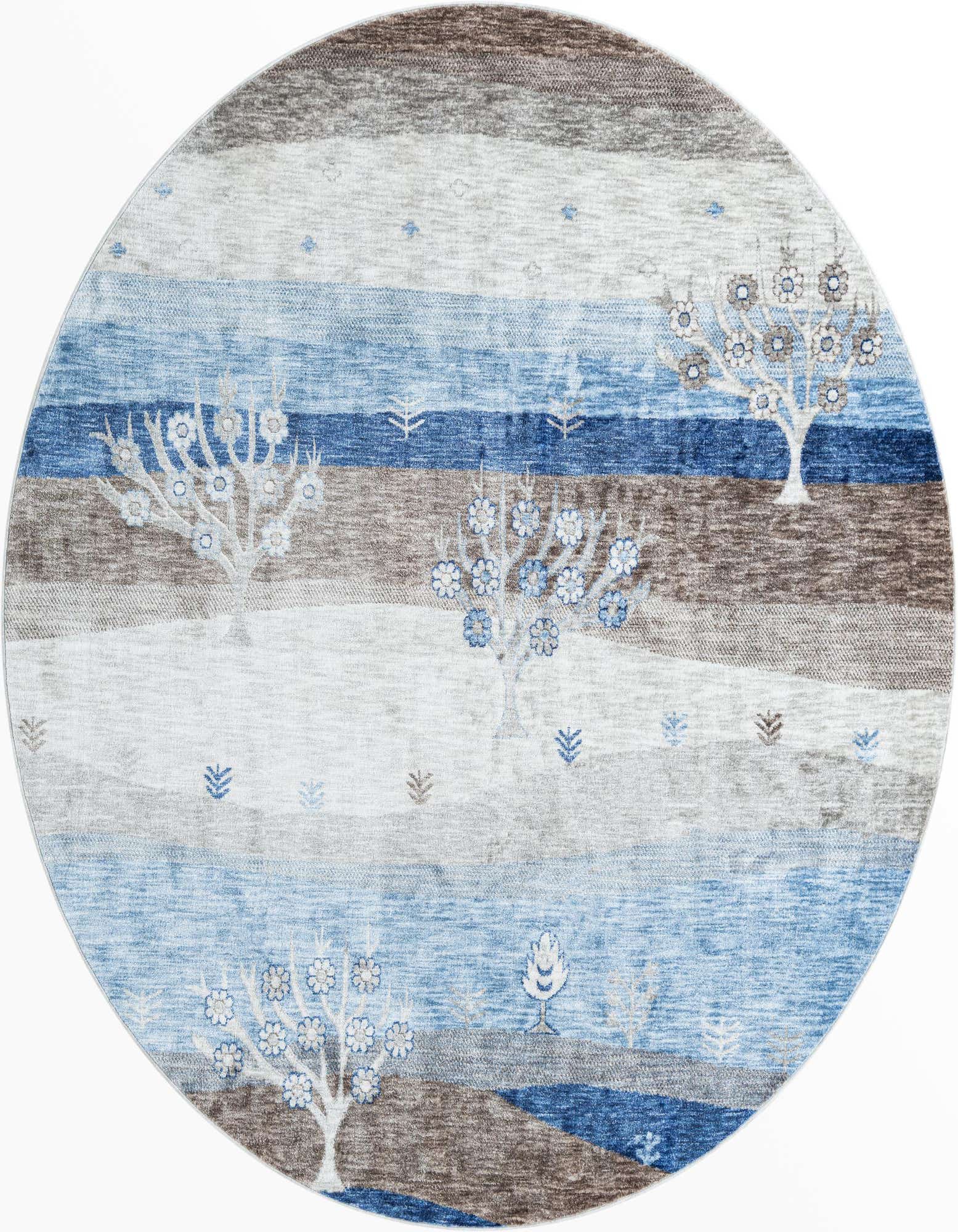 A round blue and gray tribal rug featuring whimsical trees and horizontal stripes, perfect for an indoor living space.
