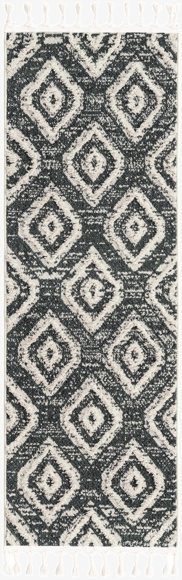 A 6 ft runner rug with a tribal trellis pattern in varying shades of blue and gray, featuring white tassels.