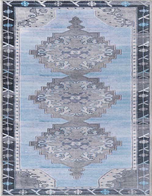 An 8 ft runner rug from the Timeless Collection featuring a vintage oriental medallion pattern in blues and grays, ideal for hallways.