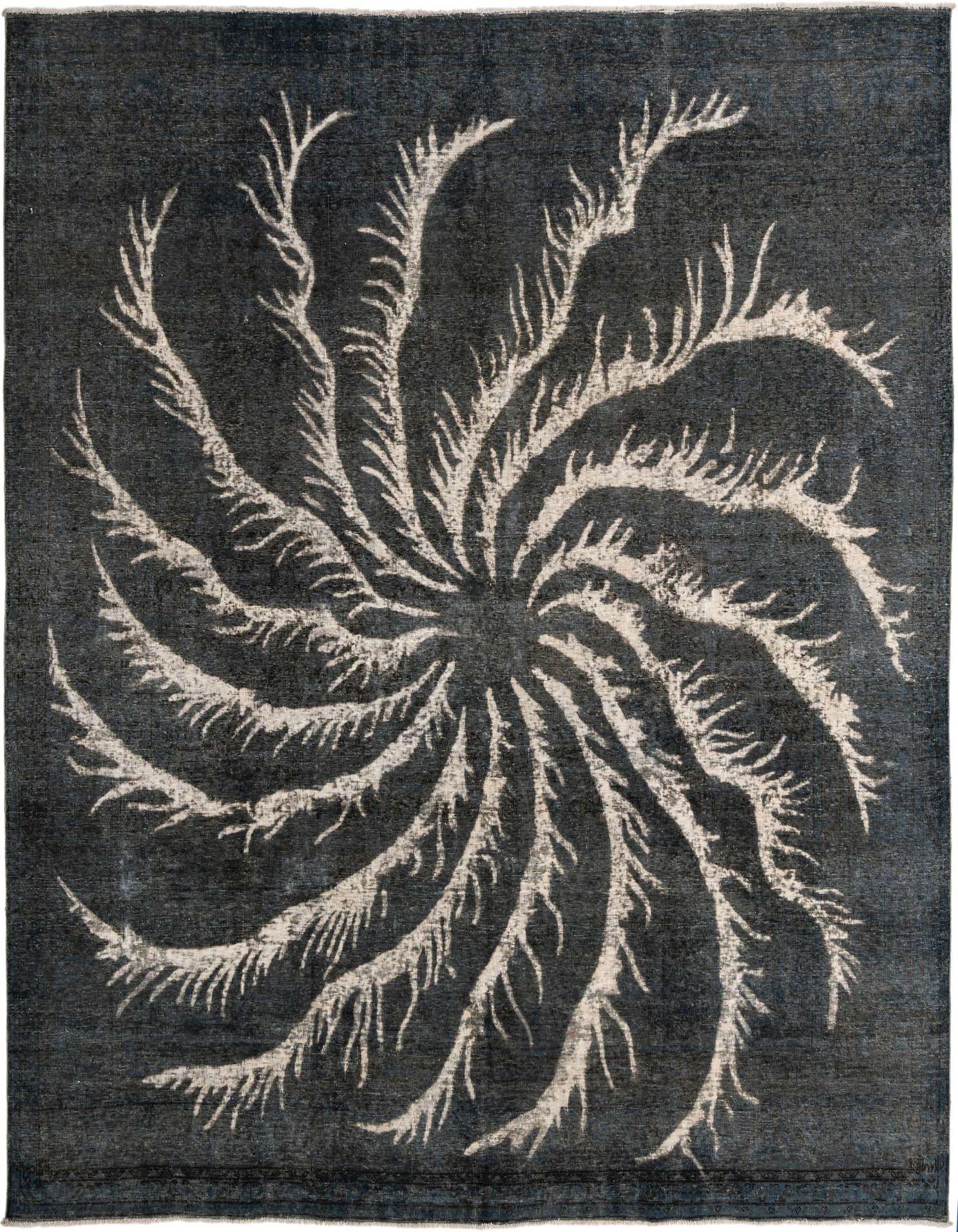 A square blue-gray wool rug with a large, light-colored swirling medallion pattern resembling a fern or feather design.