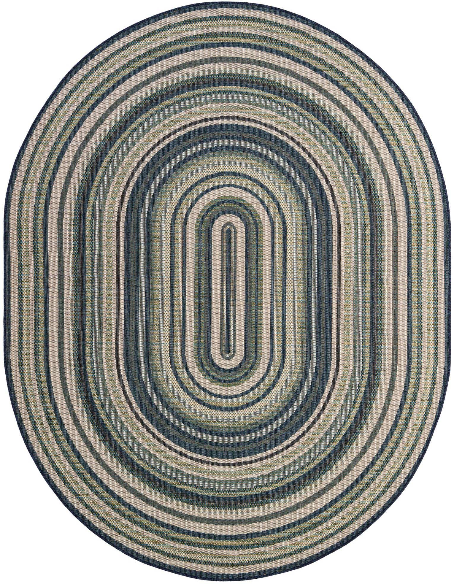 An oval Baja Outdoor rug featuring concentric stripes in varying shades of blue, teal, and beige, perfect for a patio.