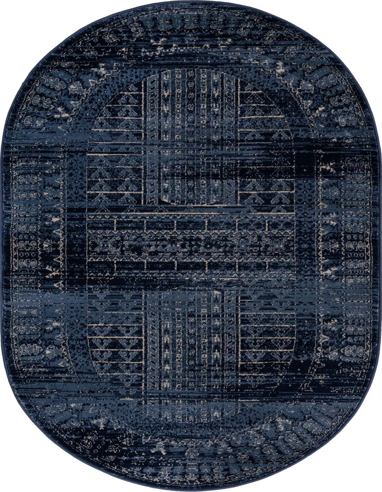 An oval blue rug with a distressed Southwestern and traditional medallion pattern in varying shades of blue and beige.