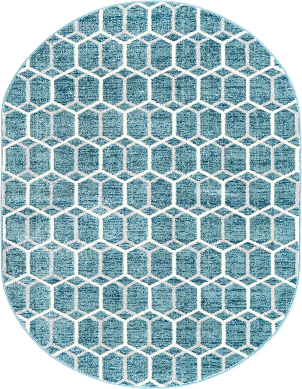 An oval blue area rug featuring a modern trellis pattern of interlocking white and light gray hexagons.