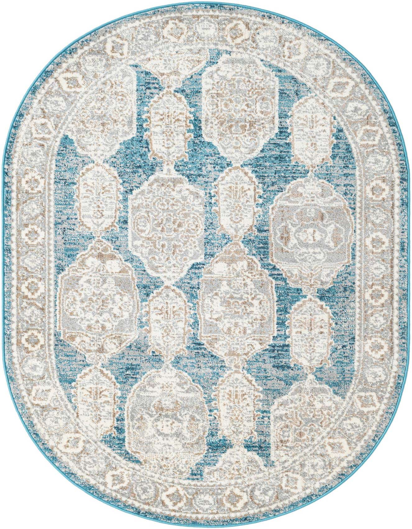 An oval 4' x 6' blue area rug with a distressed bohemian and traditional pattern in shades of cream, grey, and tan.