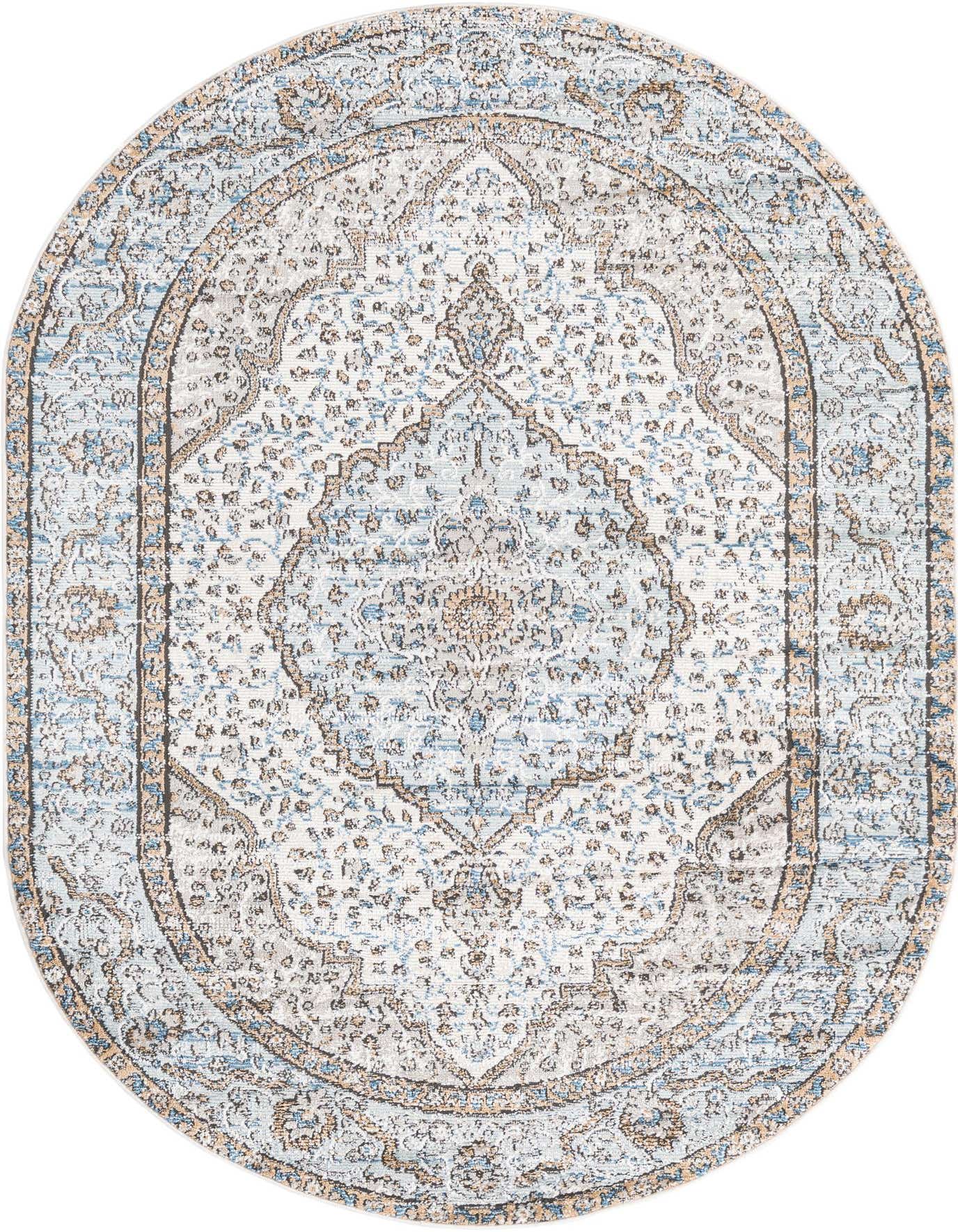 An oval 5' 3 x 8' 0 Nyla rug featuring a distressed blue and beige traditional medallion pattern.