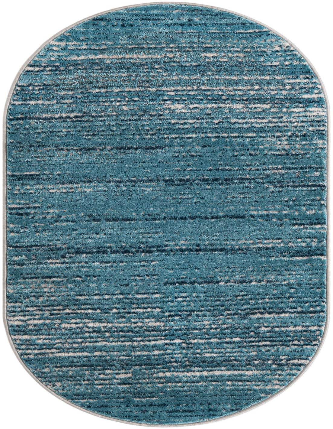 A 3' 0 x 5' 3 oval blue area rug from the Oasis Collection, featuring a textured pile with horizontal streaks of light blue, dark blue, and white.
