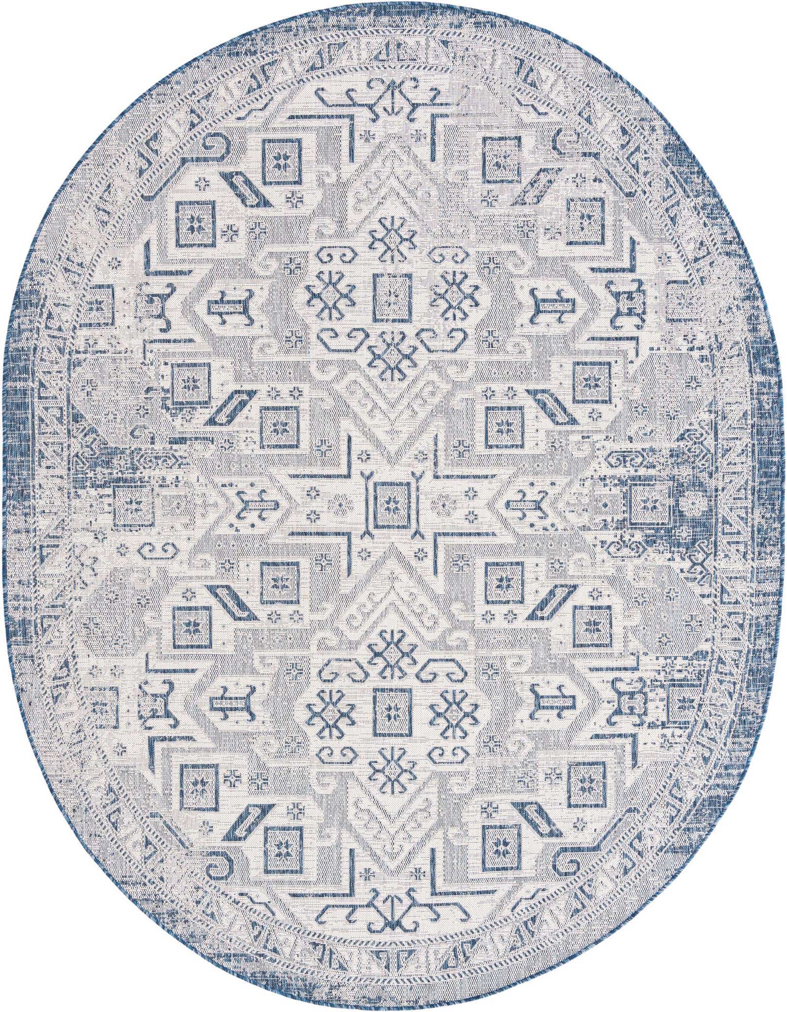 A 7' 10 x 10' 0 oval blue and white Southwestern rug, featuring a distressed tribal pattern with geometric motifs, suitable for indoor or outdoor use.