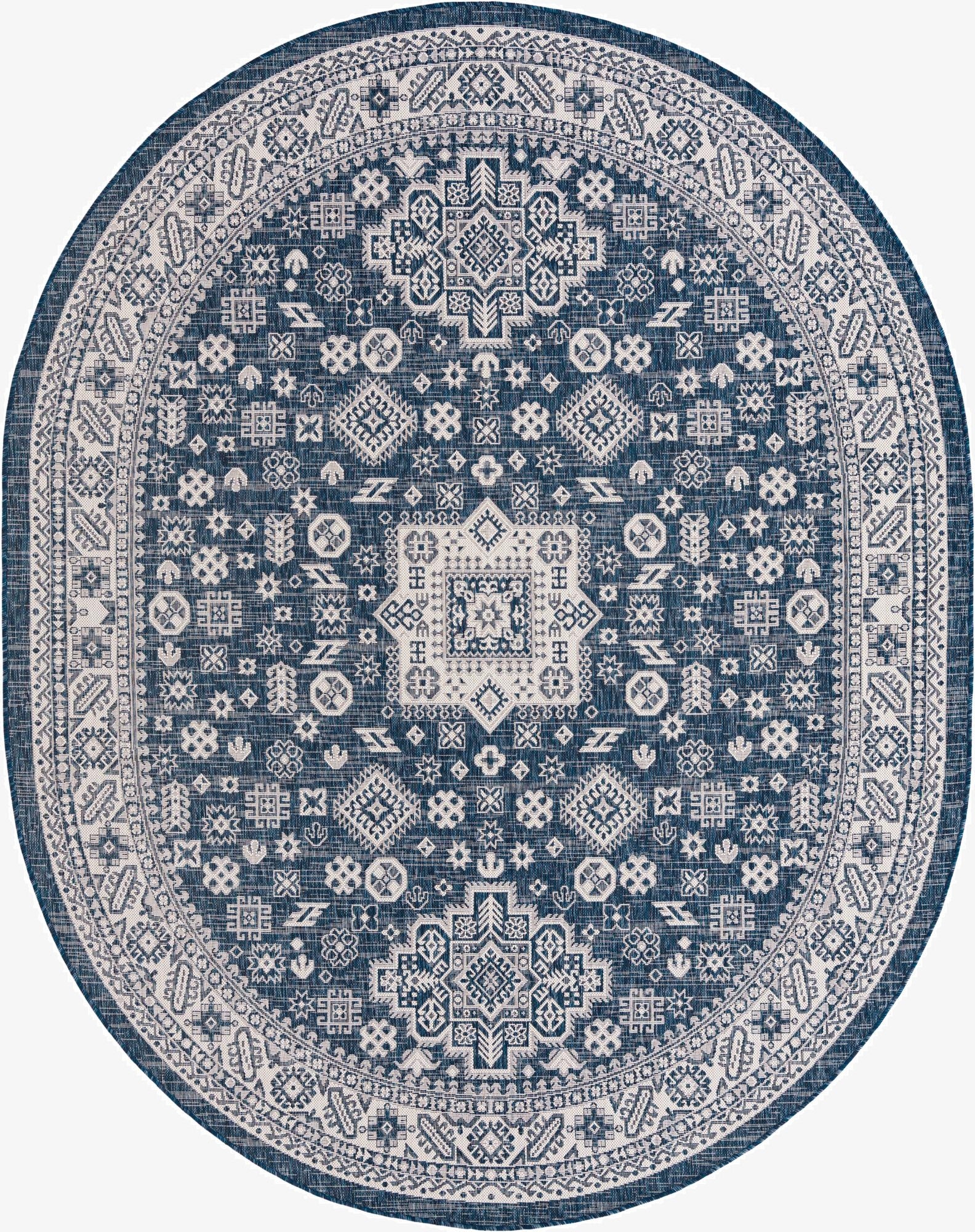 A 7'10" x 10'0" oval indoor/outdoor rug with a blue background and intricate white tribal and geometric patterns.