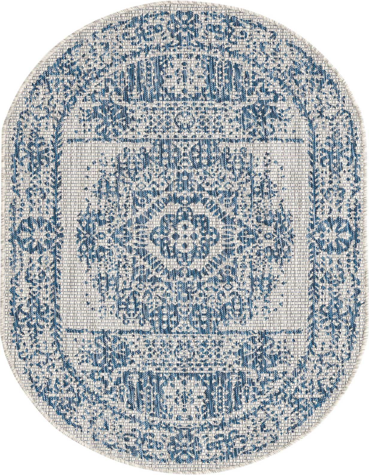 An oval 3' x 5' blue and white Southwestern-style flatweave rug, ideal for indoor or outdoor use.