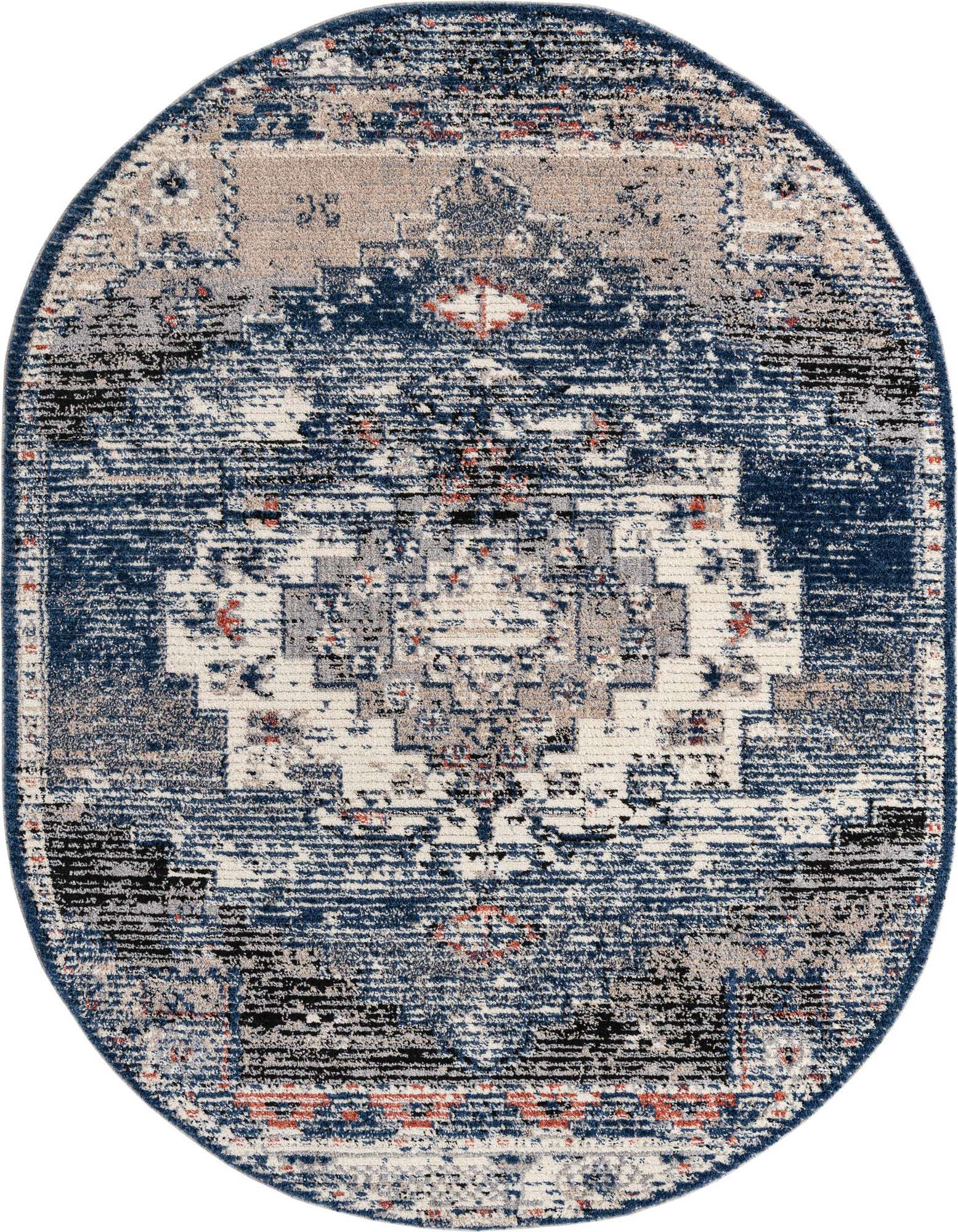 An 8'x10' oval blue Southwestern shag rug with a distressed medallion pattern in shades of blue, grey, white, and hints of orange.