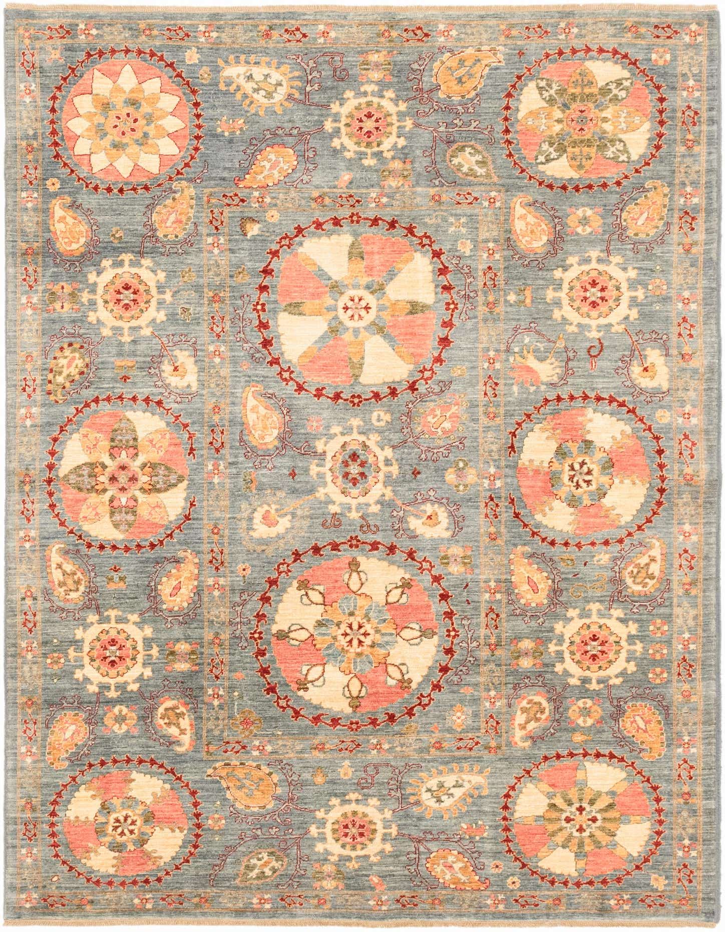 A 6x9 rectangular Ariana Ziegler rug featuring a traditional tribal pattern in shades of blue, coral, and cream.