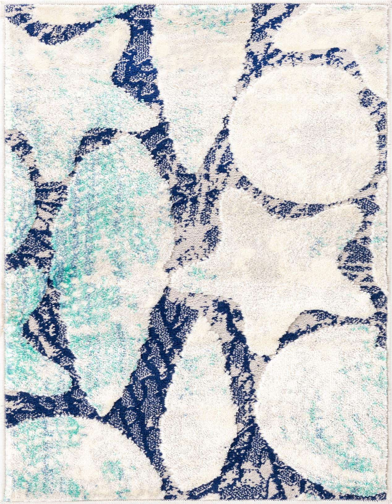 A 2x3 rectangular indoor rug with an abstract floral pattern in shades of blue, teal, and off-white.
