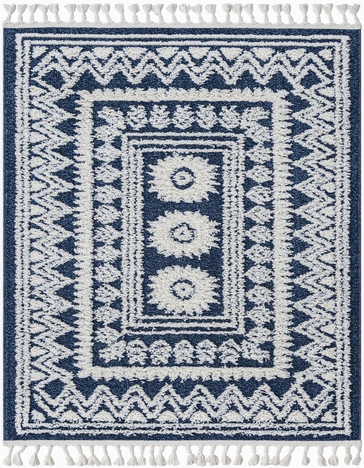 A 4x6 rectangular blue and white Southwestern Bohemian rug with tassels, featuring a central medallion and tribal patterns.