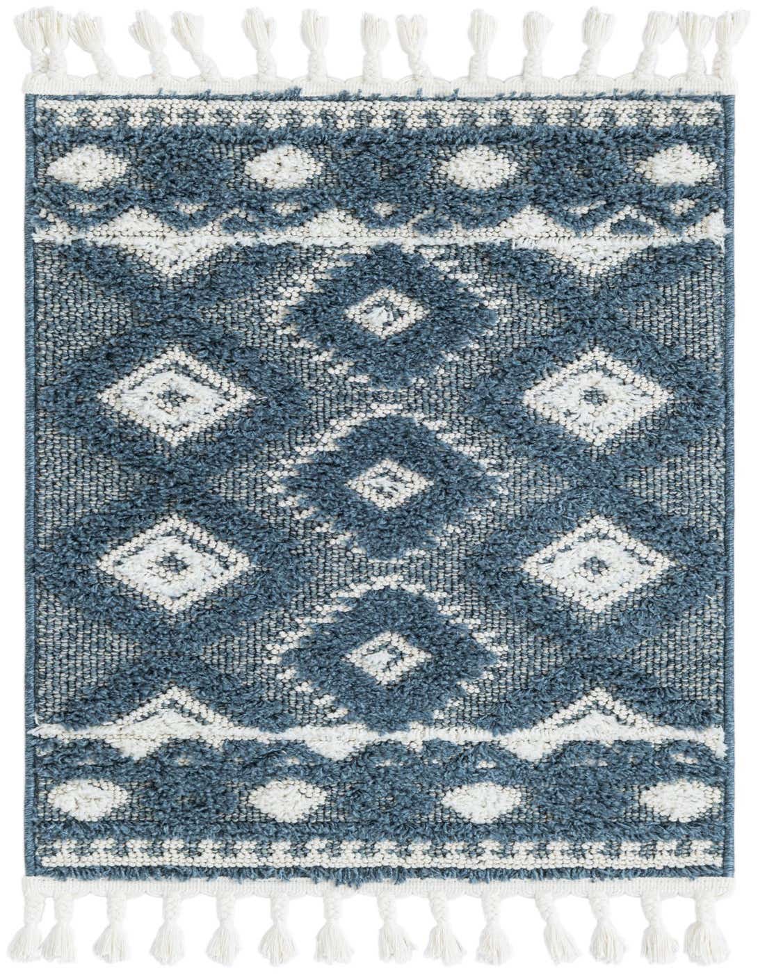 A 2x3 rectangular blue and white Southwestern rug with a tribal trellis pattern and white tassels.