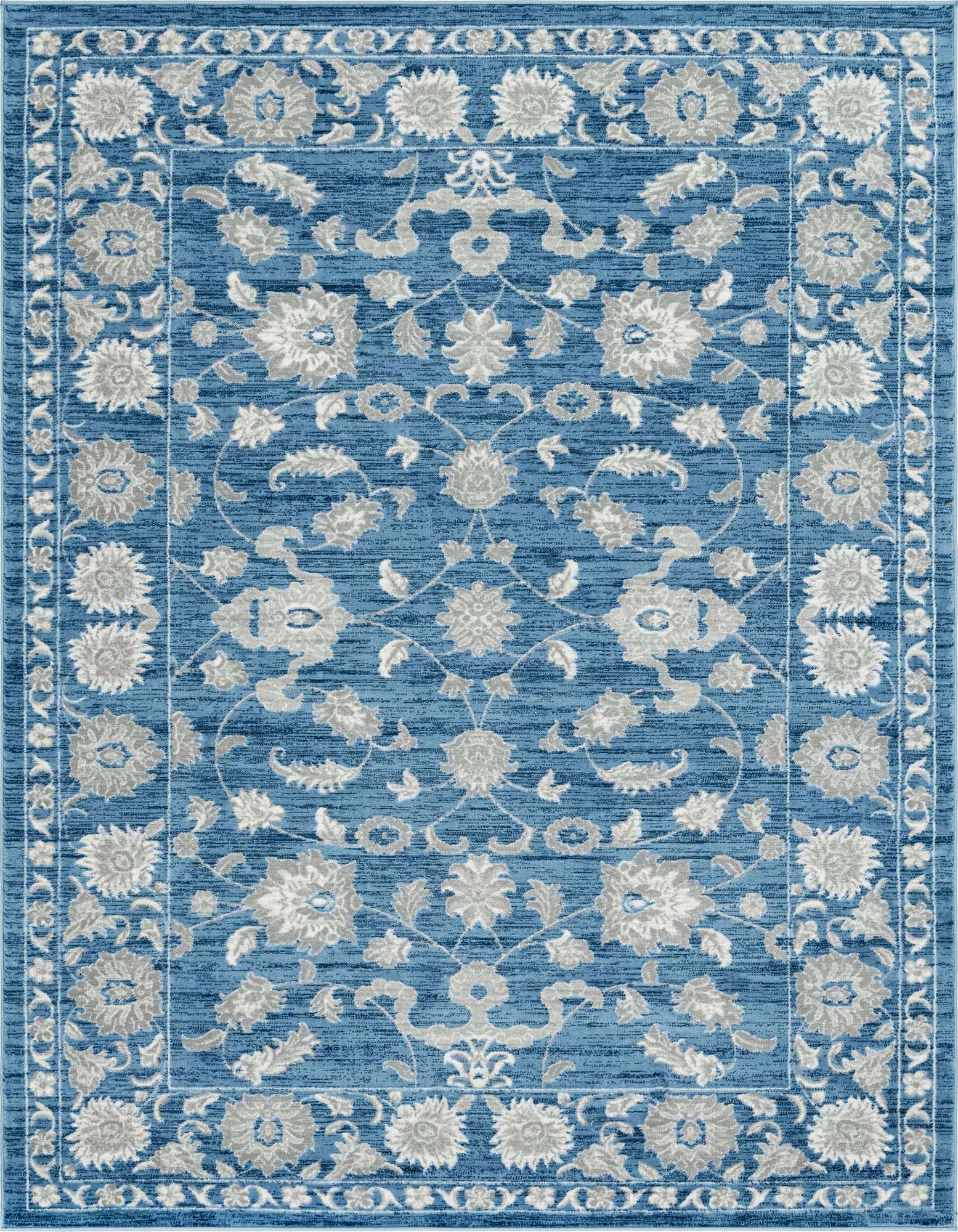 An 8x10 rectangular blue area rug with a traditional floral pattern in light gray and white, featuring a textured pile.