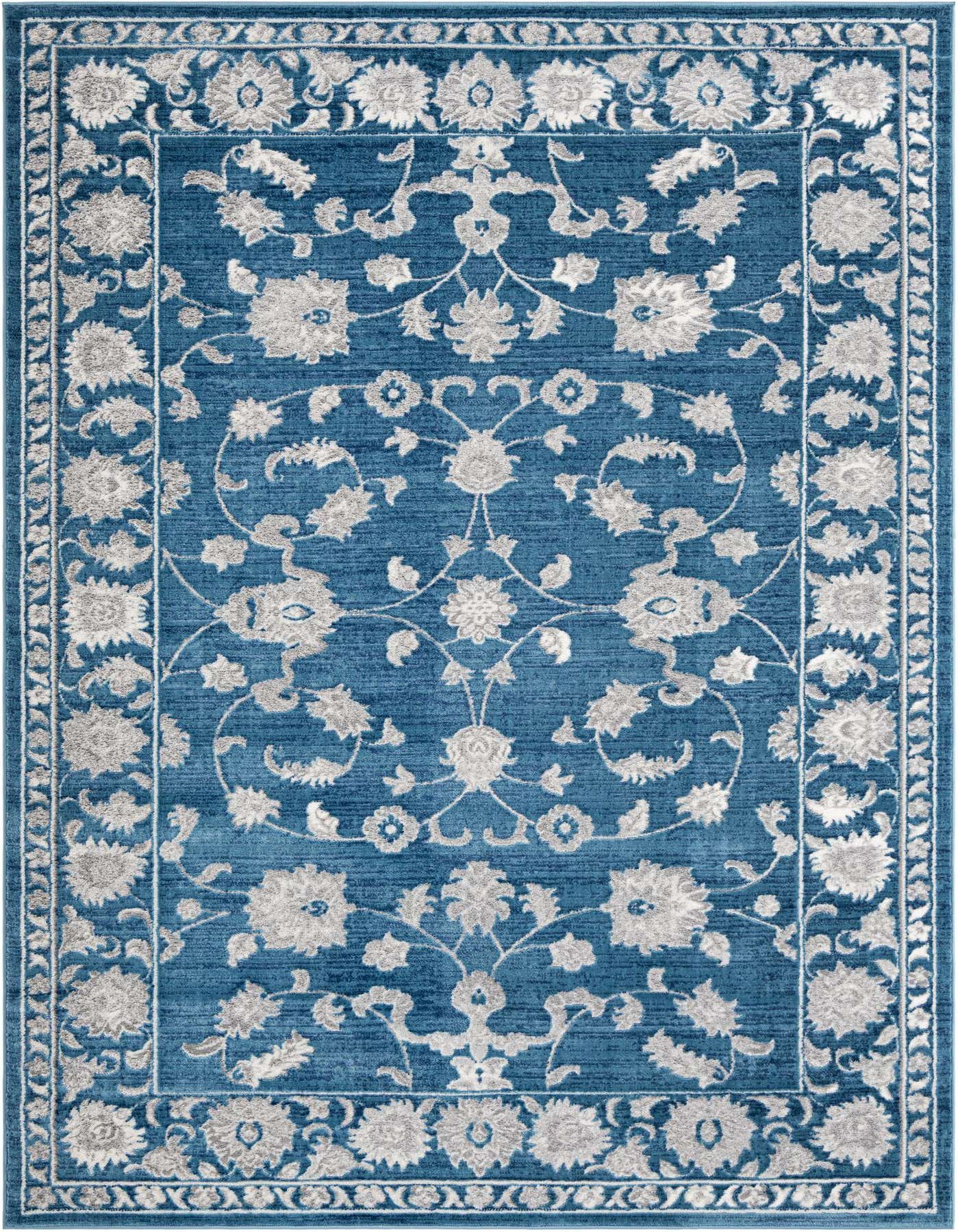 A 7x10 rectangular indoor rug in shades of blue with a detailed grey floral and vine pattern, featuring a bordered edge.