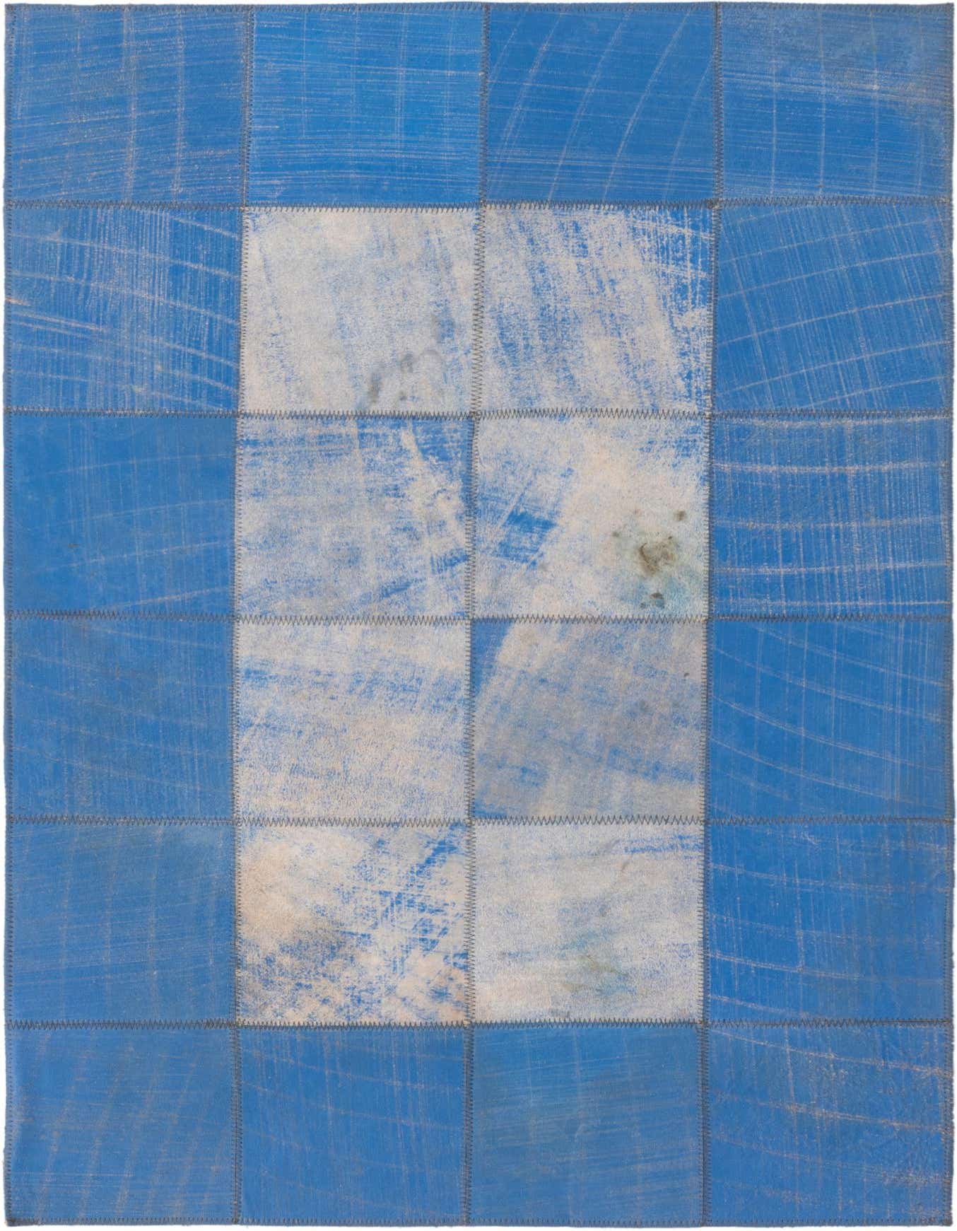 A 2x3 rectangular modern rug featuring a patchwork design of blue and white distressed cowhide squares.