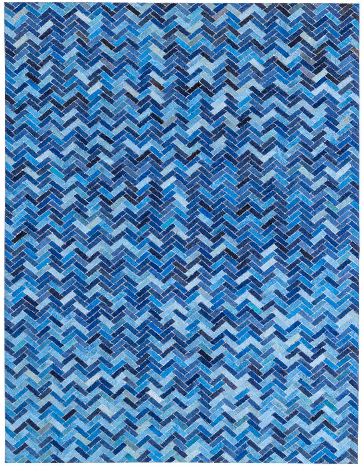 A 5x8 rectangular Cowhide rug featuring a modern herringbone pattern in various shades of blue.