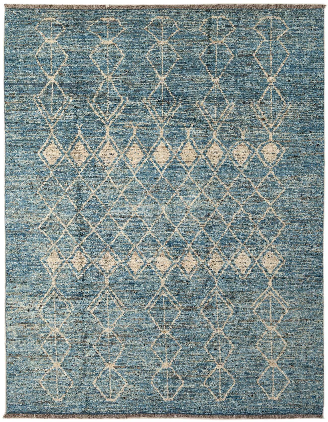 A 7x10 rectangular blue wool area rug with a modern off-white diamond pattern, suitable for a living room.