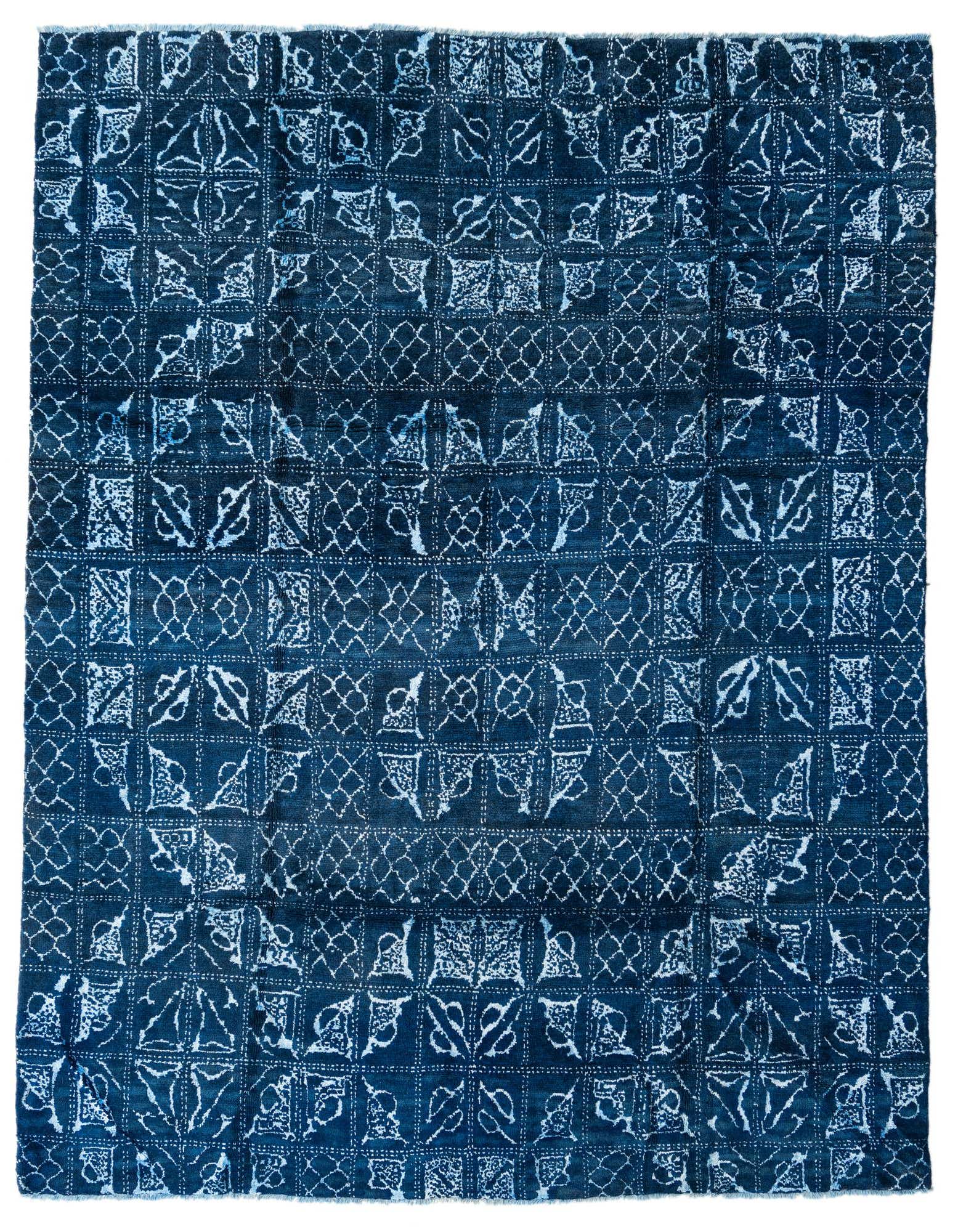 A rectangular 8x10 Darya rug with a modern abstract pattern in varying shades of blue and white.