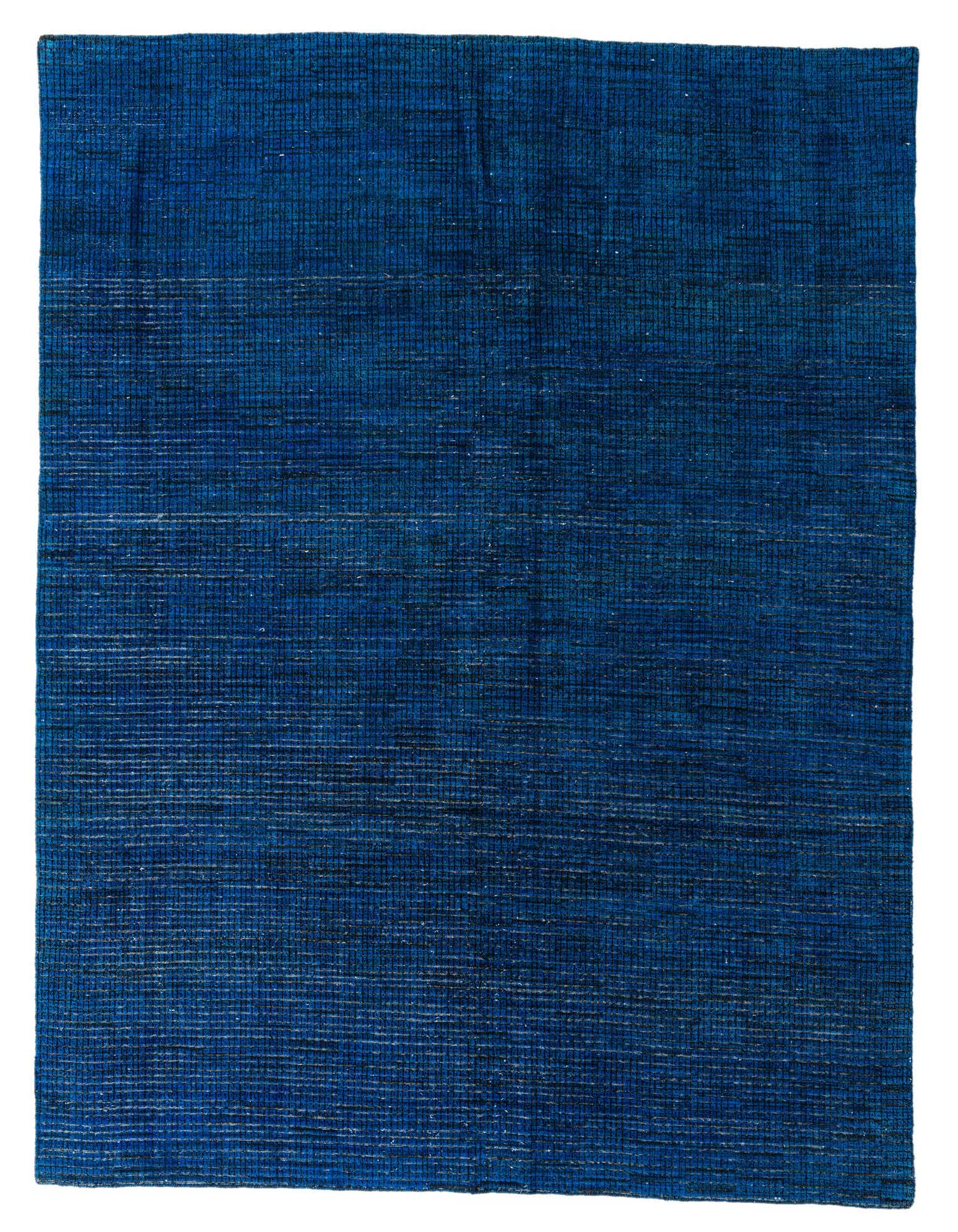 A 9x12 rectangular Darya Collection rug in varying shades of deep blue with a subtle abstract, modern pattern, ideal for a living room.